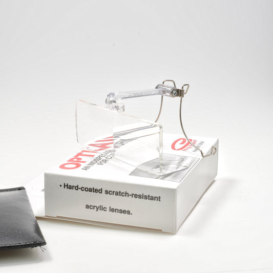 Edroy Optic-Aid clip on magnifier sitting on its box